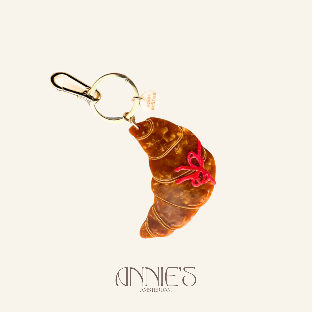 Annie's Solar eclipse bag charm croissant